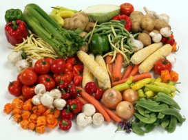 a-pile-of-different-types-of-vegetables-on-a-white-surface.jpg a pile of different types of vegetables on a white surface